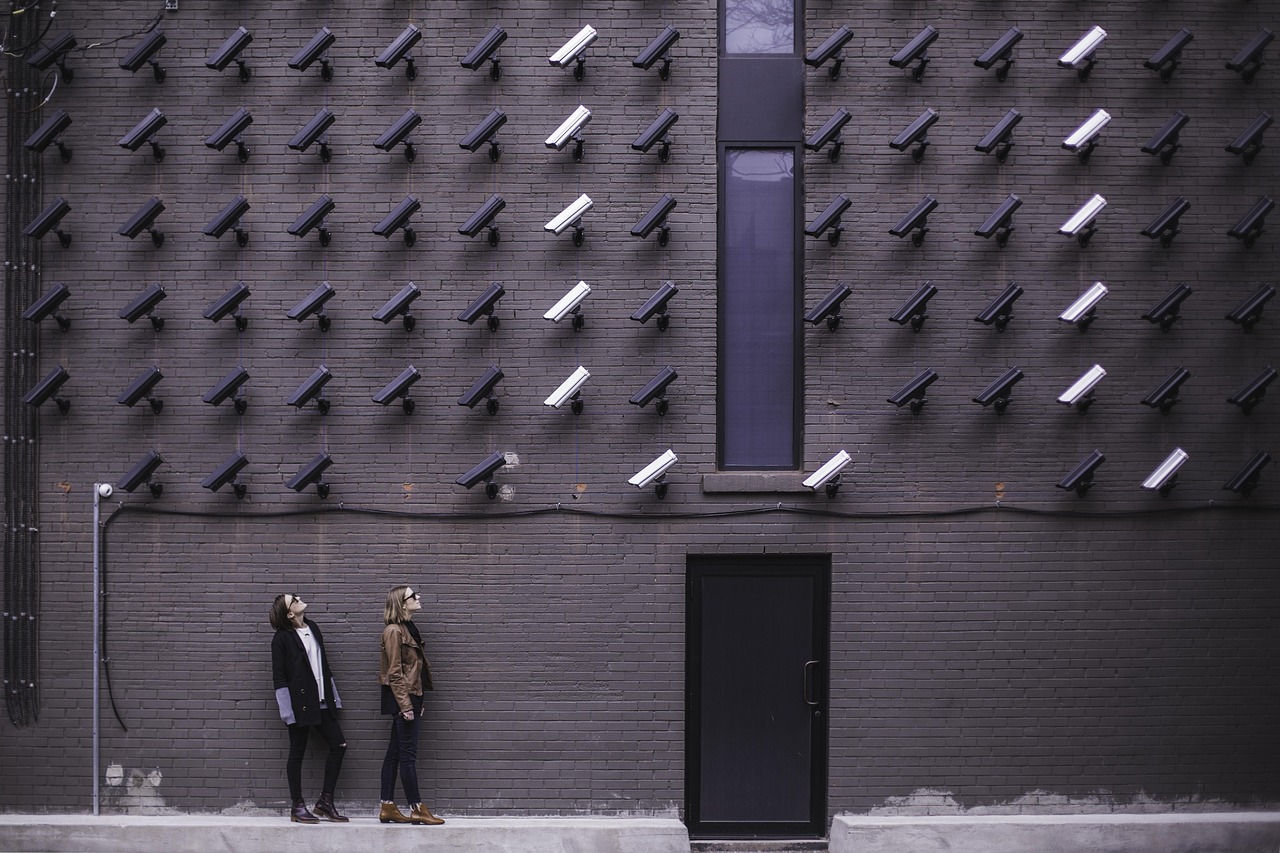 Building, cctv, door, female, ladies, pattern, people, security cameras, shape, steel and concrete structure, wall, women, gray building, gray camera, gray wall, gray security, gray door, gray pattern